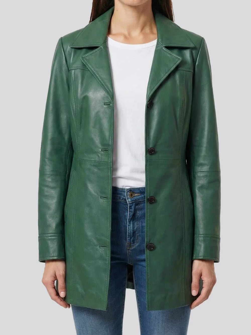Green leather coat worn by a person on a light gray background